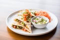 beef quesadilla with pico de gallo on top