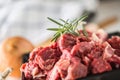 Beef. Raw sliced beef meat garlic onion salt pepper and rosemary Royalty Free Stock Photo