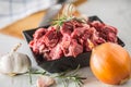 Beef. Raw sliced beef meat garlic onion salt pepper and rosemary Royalty Free Stock Photo