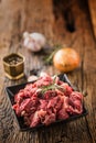 Beef. Raw sliced beef meat garlic onion salt pepper and rosemary Royalty Free Stock Photo