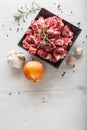 Beef. Raw sliced beef meat garlic onion salt pepper and rosemary Royalty Free Stock Photo