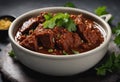 Beef Rendang is a Minang dish originating from the Minangkabau region in West Sumatra, Indonesia. Isolated on grey background.