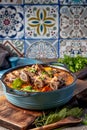 Beef ribs Bourguignonne in blue casserole. Homemade beef stew with vegetables and red wine Royalty Free Stock Photo