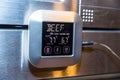Beef roasting meat temperature conrol unit on silver oven Royalty Free Stock Photo