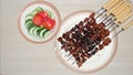 Top view beef satay is ready to serve with side vegetables Royalty Free Stock Photo