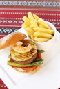 Beef and seafood burger with fries Royalty Free Stock Photo