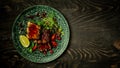Beef Short Ribs with a spicy berry sauce and served with green seedlings on the plate. Shallow Depth of Field. concept of Asian Royalty Free Stock Photo