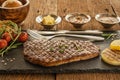 Beef shoulder steak on stone plate with sauce and bread and butter Royalty Free Stock Photo