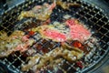 Beef slice grilled on yakiniku stove which has hot charcoal. Barbecue Japanese style.