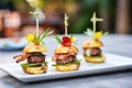 beef sliders with grilled pineapple rings and bacon Royalty Free Stock Photo