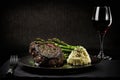 Beef steak with asparagus and mashed potatoes and wine. Royalty Free Stock Photo