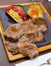 Beef steak with baked potatoes, vegetables, romesco Royalty Free Stock Photo