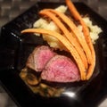 beef steak with carrott stripes and purree