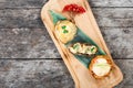 Beef steak and Chicken breast with tomatoes and cheese on cutting board on wooden background Royalty Free Stock Photo