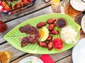 Beef steak with chicken wings and fruits Royalty Free Stock Photo