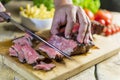 Beef steak cut on chopping board Royalty Free Stock Photo