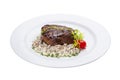 Beef steak with forest mushrooms. On a white plate