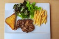 Beef steak with Garlic bread with French fries