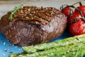 Beef steak grilled with asparagus, tomatoes, spice Royalty Free Stock Photo