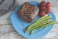 Beef steak grilled with asparagus tomatoes spice on plate