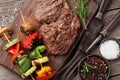 Beef steak and grilled vegetables on cutting board Royalty Free Stock Photo