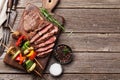 Beef steak and grilled vegetables on cutting board Royalty Free Stock Photo