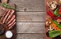 Beef steak and grilled vegetables on cutting board Royalty Free Stock Photo