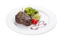 Beef steak with Guacamole sauce. On a white plate Royalty Free Stock Photo