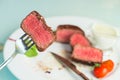 beef steak impaled on fork Royalty Free Stock Photo