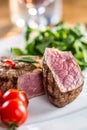 Beef Steak. Juicy beef steak. Gourmet steak with vegetables and glass of rose wine on wooden table Royalty Free Stock Photo