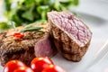 Beef Steak. Juicy beef steak. Gourmet steak with vegetables and glass of rose wine on wooden table Royalty Free Stock Photo