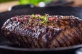 Beef steak. Juicy Rib Eye steak in pan on wooden board with herb and pepper Royalty Free Stock Photo