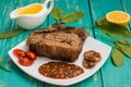 Beef steak medium rare on the grill with barbecue sauce. wood background Royalty Free Stock Photo