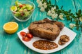 Beef steak medium rare on the grill with barbecue sauce. wood background Royalty Free Stock Photo