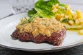 Beef steak with mustard herb crust and romaine lettuce hearts wi