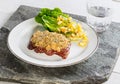 Beef steak with mustard herb crust and romaine lettuce hearts wi Royalty Free Stock Photo