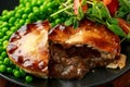 Beef steak pies with rich onion gravy served with sweet peas and salad Royalty Free Stock Photo