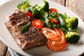 Beef steak with prawns and broccoli, tomatoes, arugula closeup o Royalty Free Stock Photo