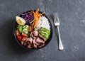 Beef steak, rice and vegetable power bowl. Healthy balanced food concept. On a dark background