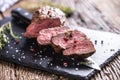 Beef Steak. Roasted Beef steak with salt pepper thyme on rustic wooden table