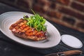 Beef steak with sauce and salad, served with beer, product photography for american restaurant and gastronomy