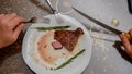 Beef steak with a sprig of rosemary in a pan. Royalty Free Stock Photo