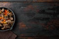 Beef stew goulash - rustic style, in cast iron frying pan, on old dark  wooden table , top view flat lay, with copy space for text Royalty Free Stock Photo