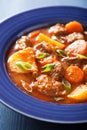 Beef stew with potato and carrot in blue plate Royalty Free Stock Photo