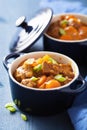 Beef stew with potato and carrot in blue pot Royalty Free Stock Photo
