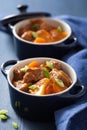 Beef stew with potato and carrot in blue pots Royalty Free Stock Photo