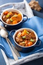 Beef stew with potato and carrot in blue pots Royalty Free Stock Photo