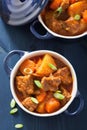 Beef stew with potato and carrot in blue pots Royalty Free Stock Photo