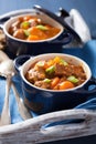 Beef stew with potato and carrot in blue pots Royalty Free Stock Photo