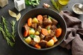 Beef stew with potatoes, carrots and greens